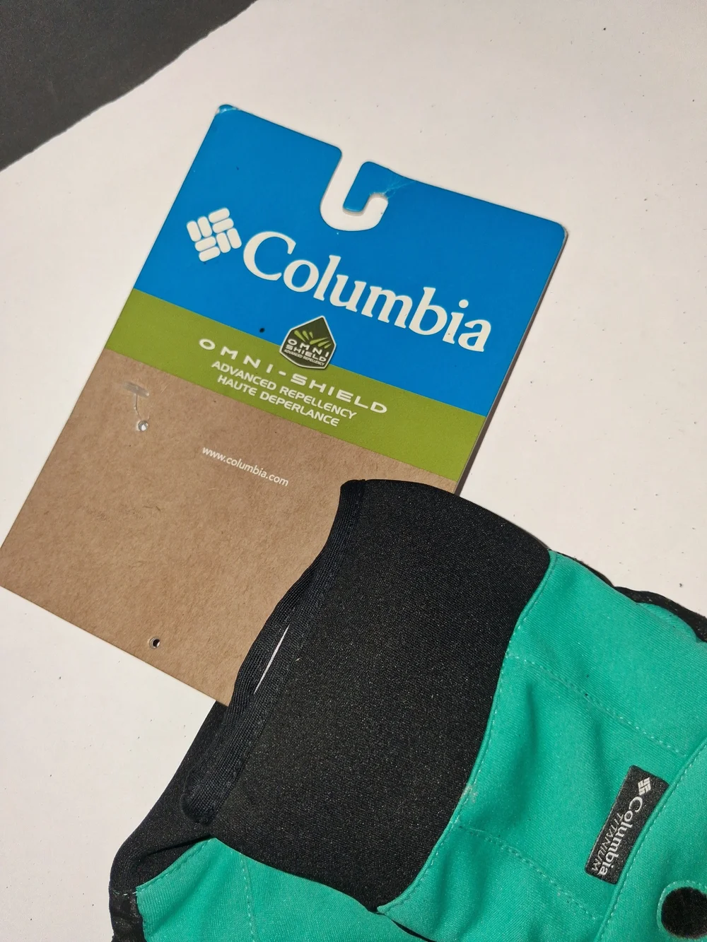 Columbia Omni-Shield teal and black outdoor gloves featuring textured grip palms
